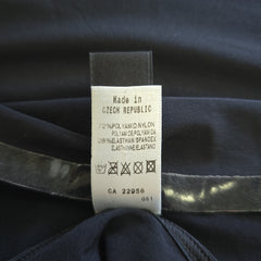 Clothing label on a dark fabric background