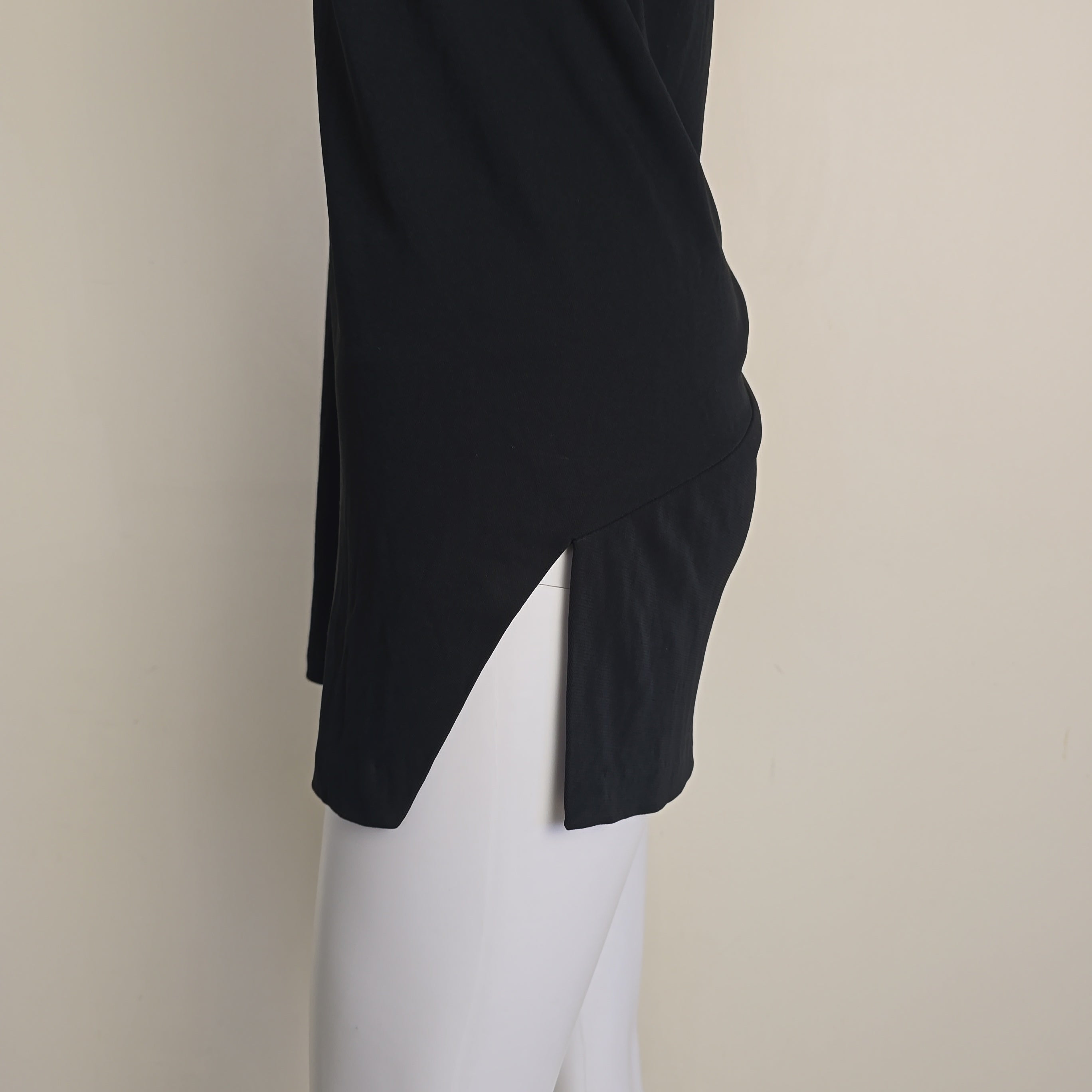 Black mini dress on a light background