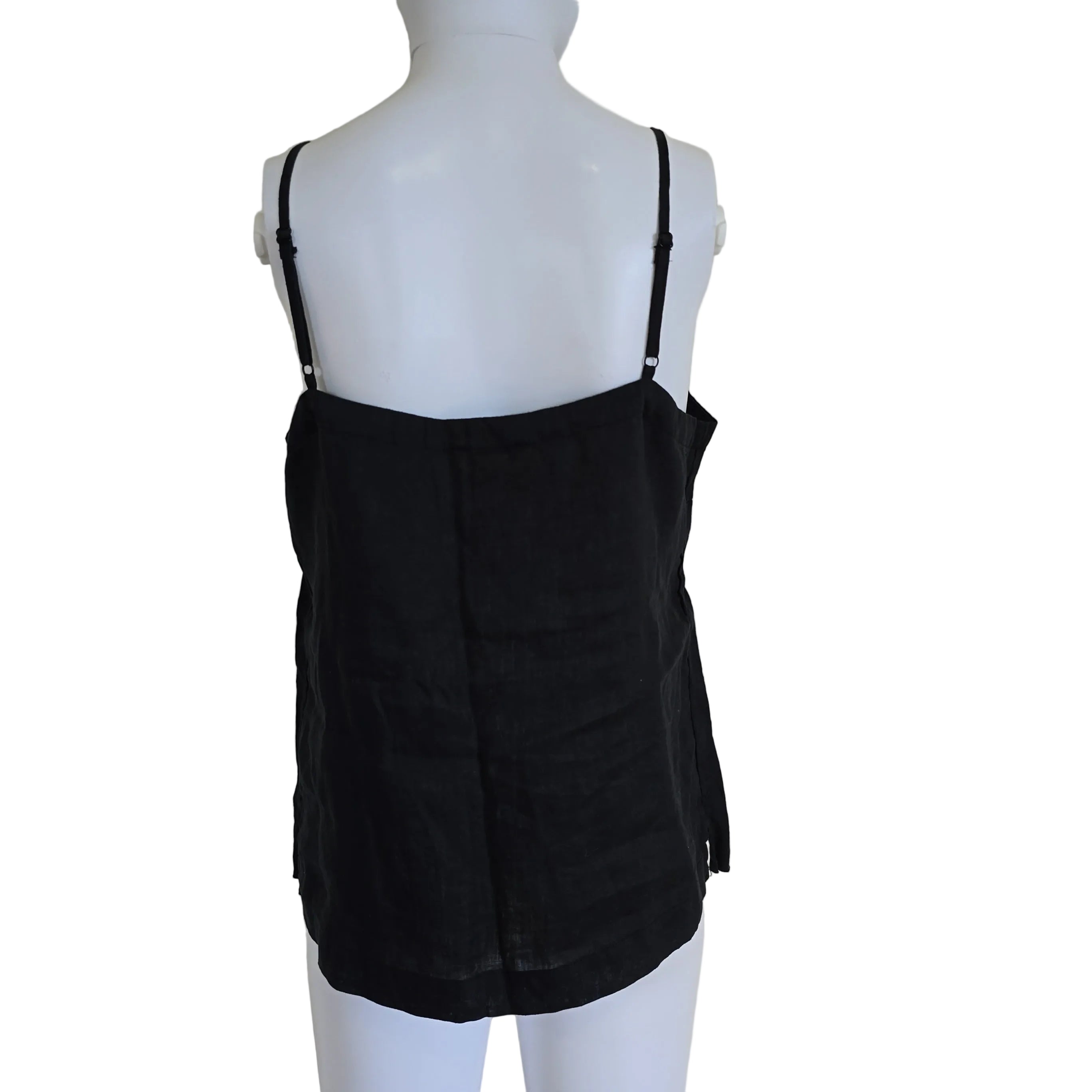 Black top on a mannequin against a light background