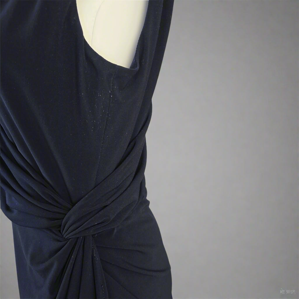 Navy blue dress on a light gray background