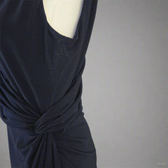 Navy blue dress on a light gray background