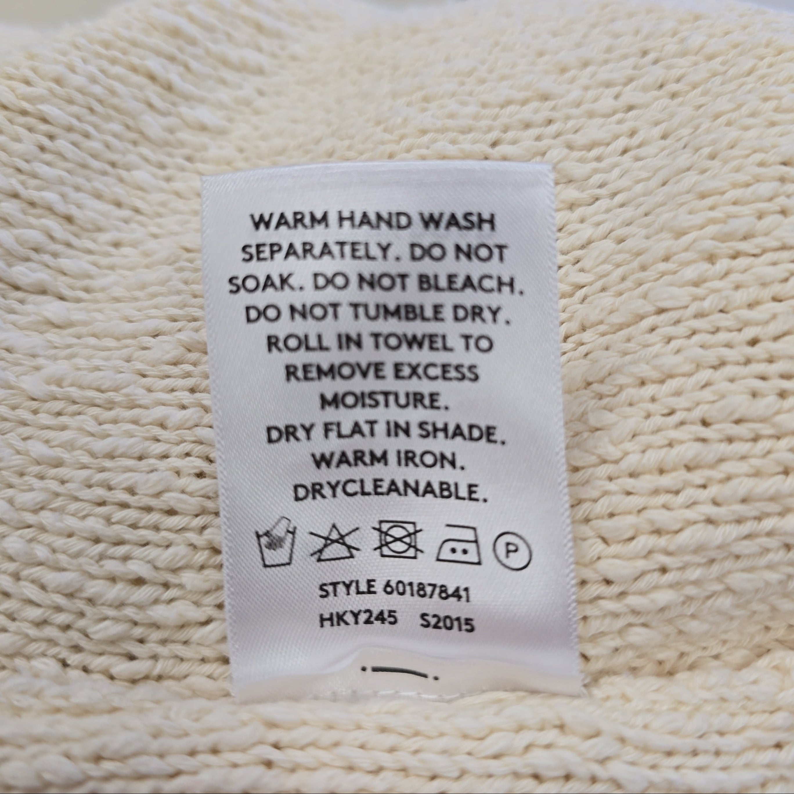 Clothing label on a textured fabric background
