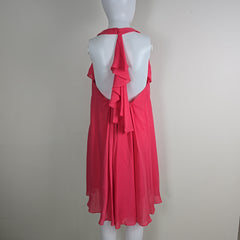 Mannequin wearing a red dress against a plain background