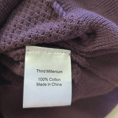 Label on a purple garment indicating 'Third Millennium', '100% Cotton', and 'Made in China'.