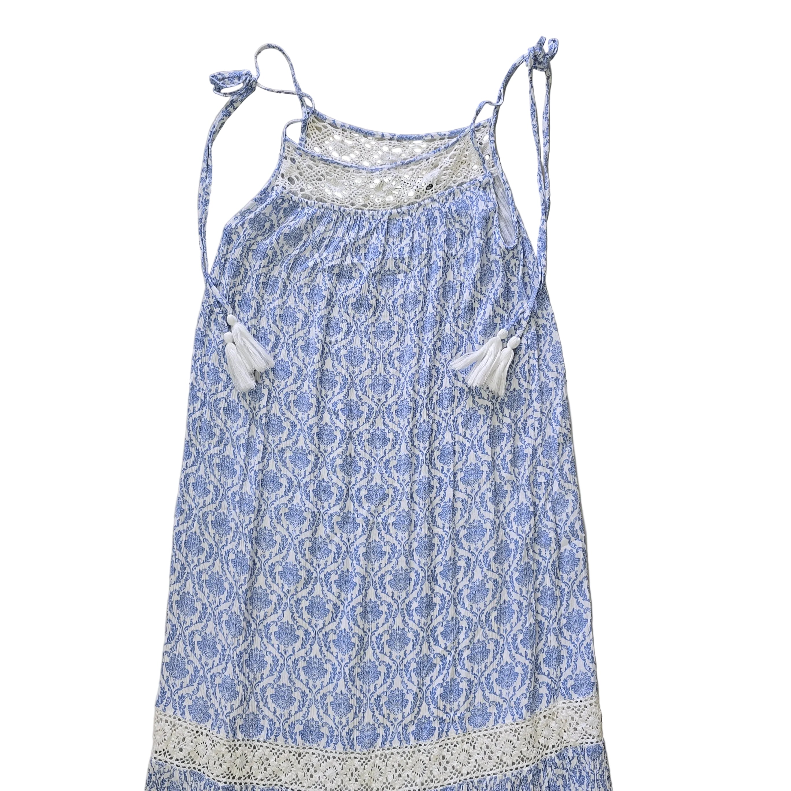 Blue and white patterned dress on a light background