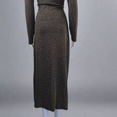 Black and gold textured dress on a mannequin against a light gray background