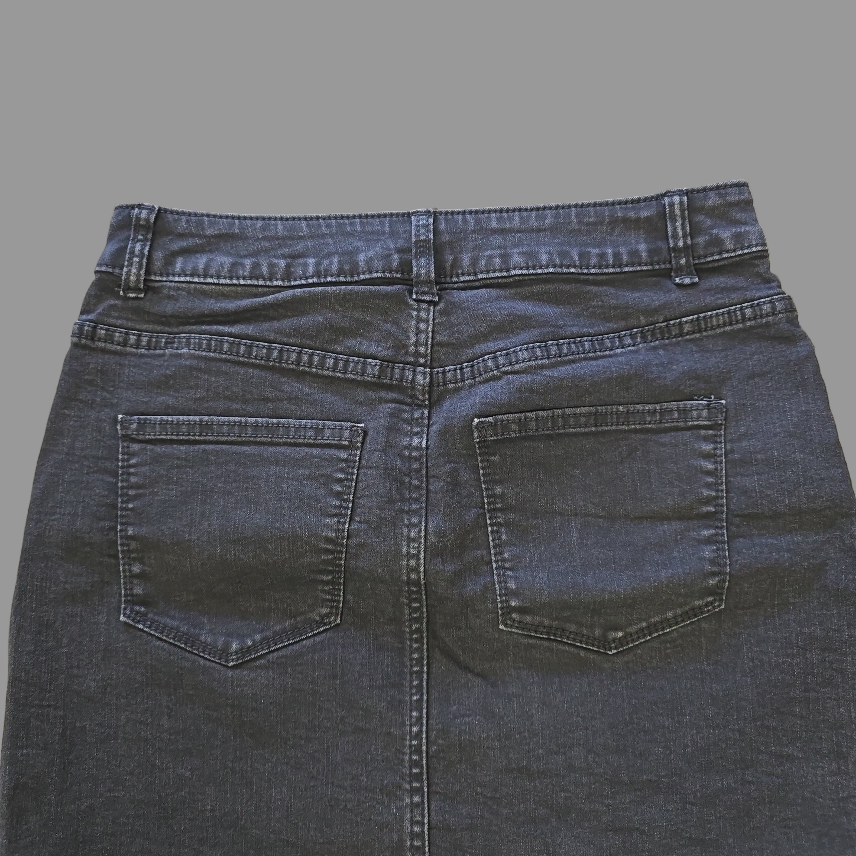 Grey skirt on a tiled floor