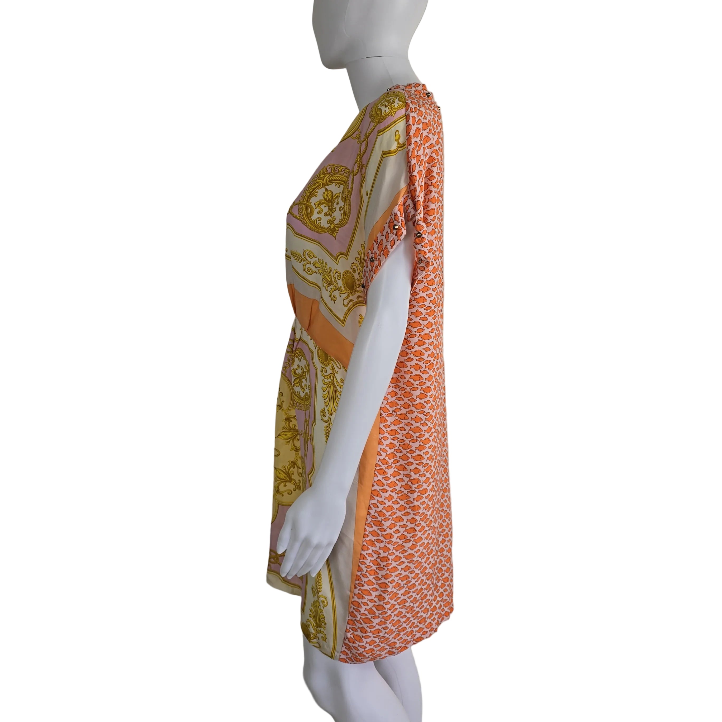 Mannequin wearing a patterned dress with a plain background