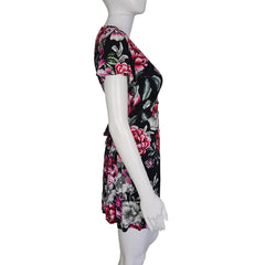 Floral-patterned dress on a mannequin against a plain background