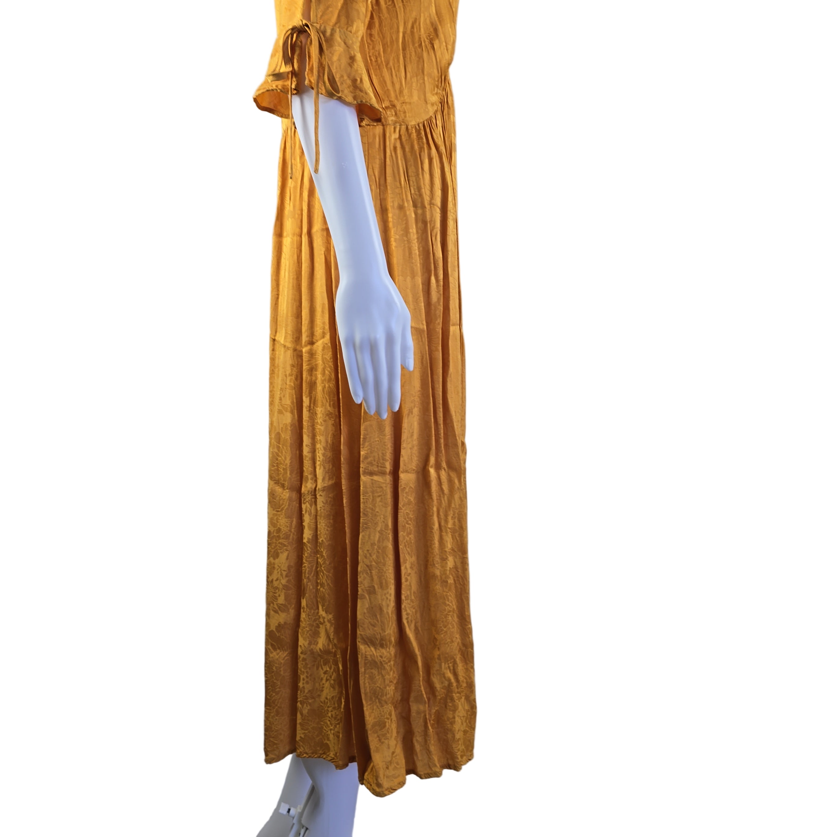 Yellow dress on a mannequin with a white background