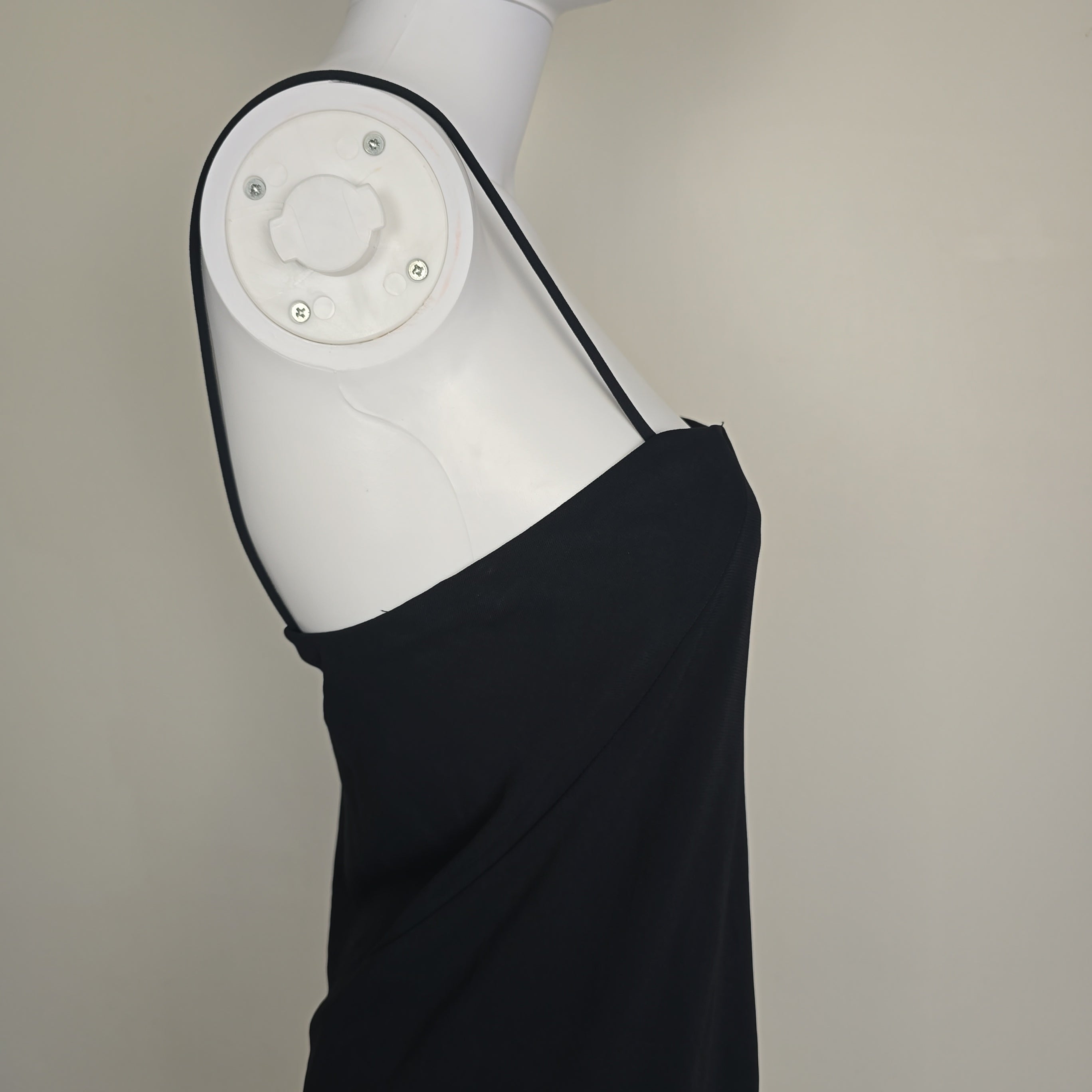 Black mini dress on a light background