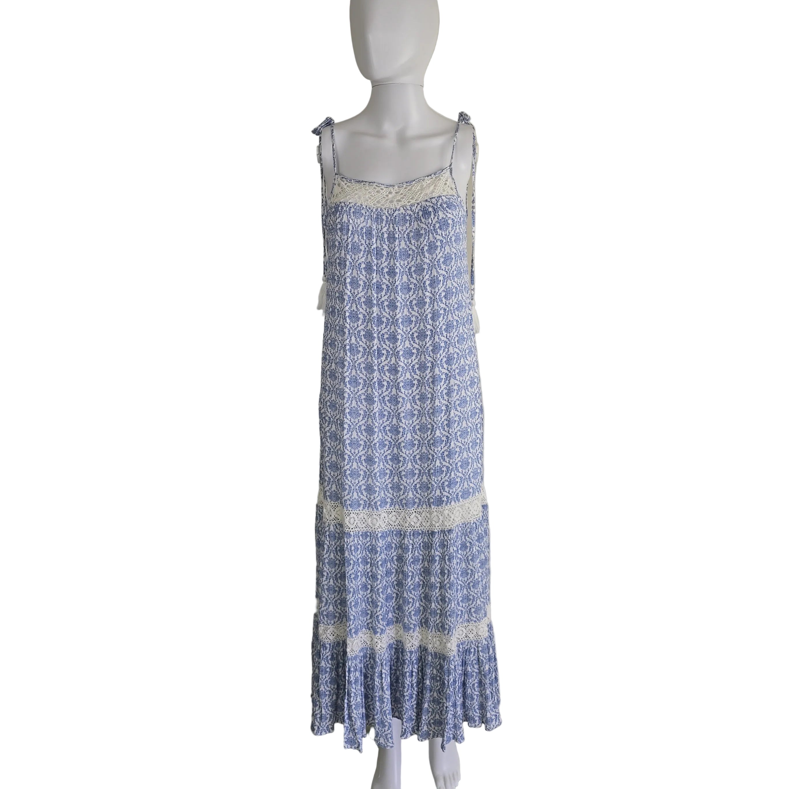 Blue and white patterned dress on a light background