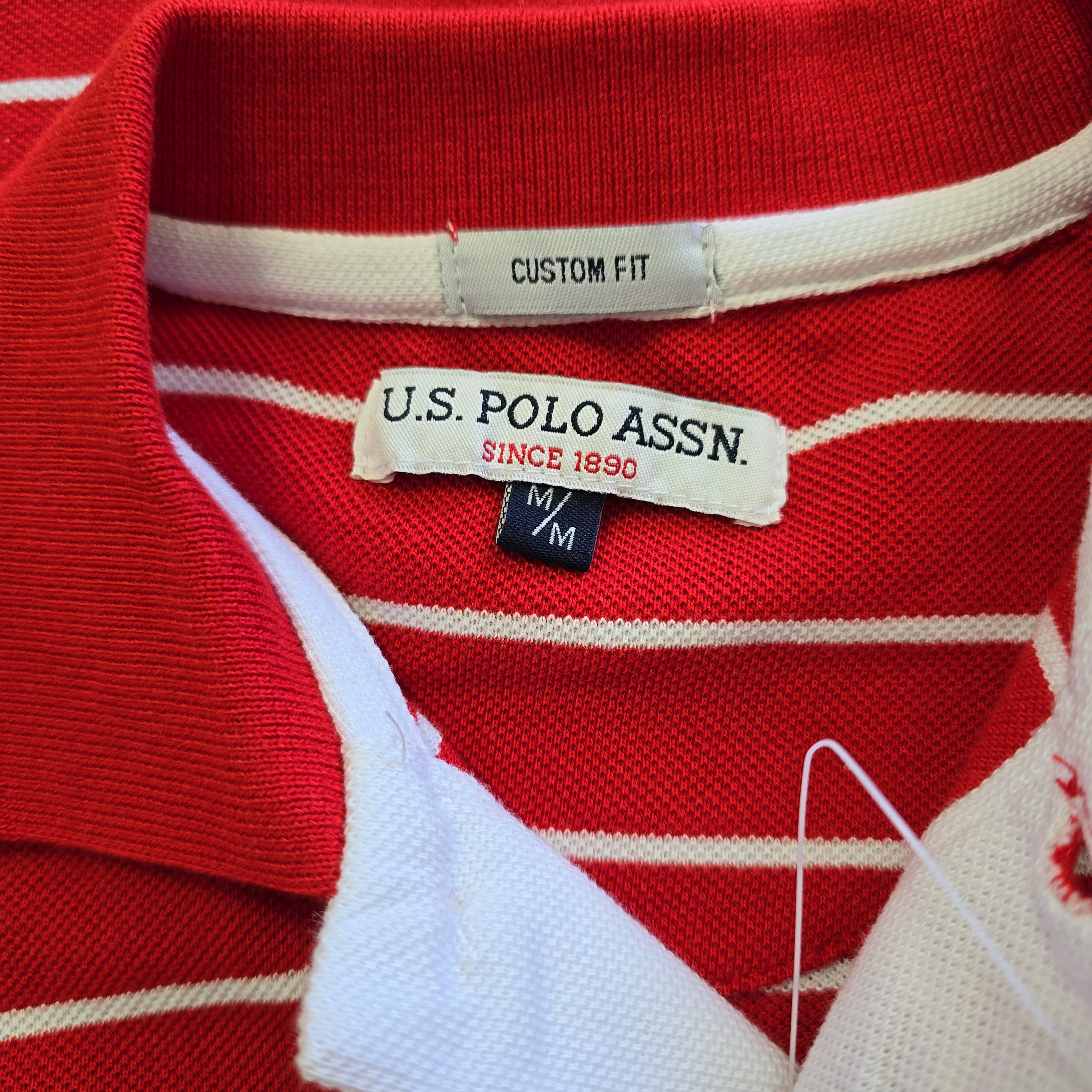 Red and white striped shirt with U.S. Polo Assn. label