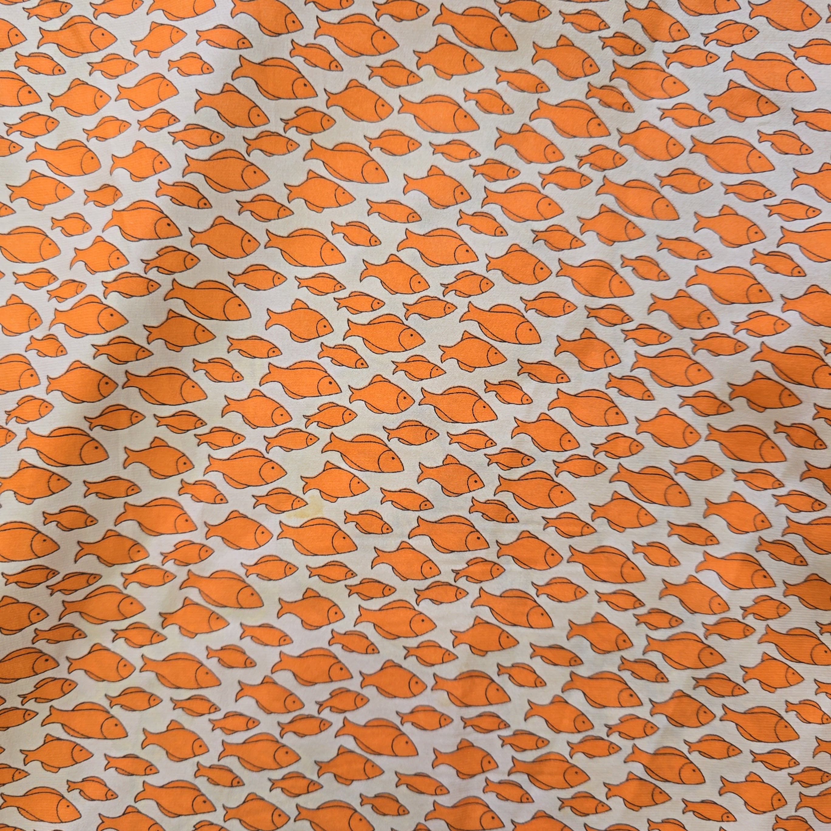Pattern of orange fish on a light gray background