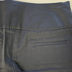 Black pants with a pocket on a light beige background