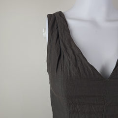 Dark gray dress on a mannequin against a white background