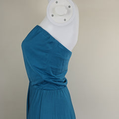 Blue dress on a mannequin against a neutral background