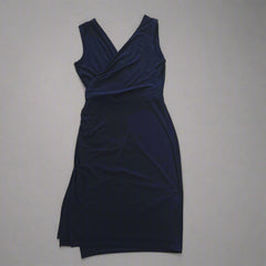 Navy blue dress on a light gray background