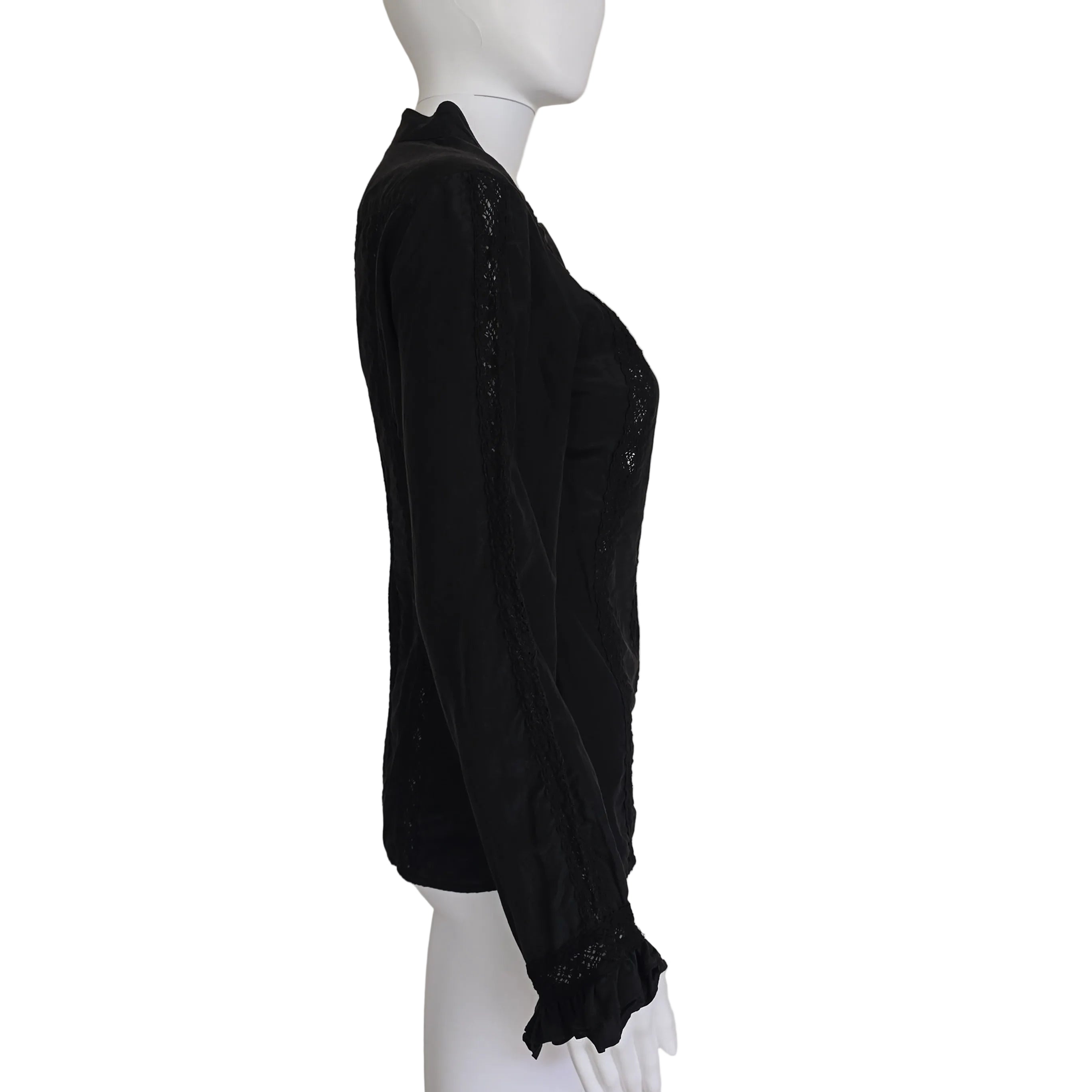 Black long sleeved button up top with black lace details on a light background