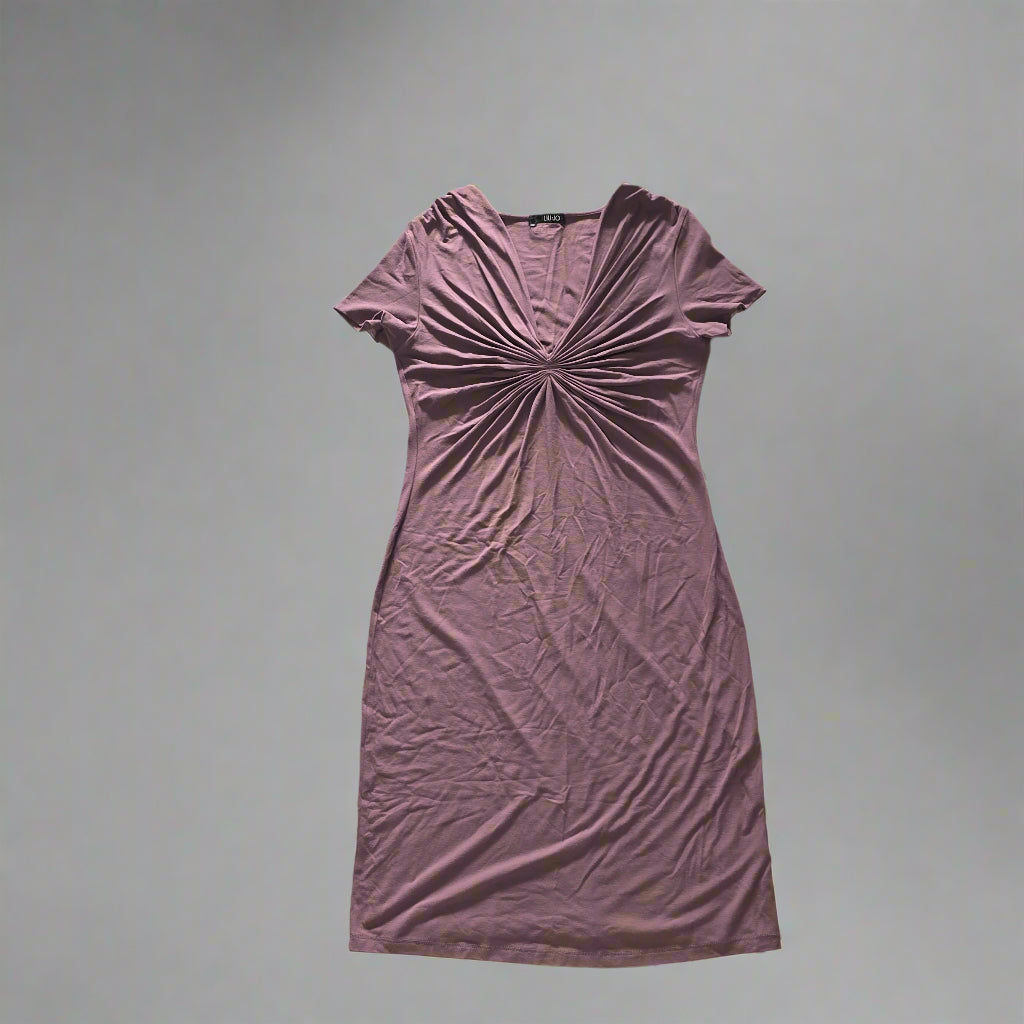 Purple dress on a tiled floor