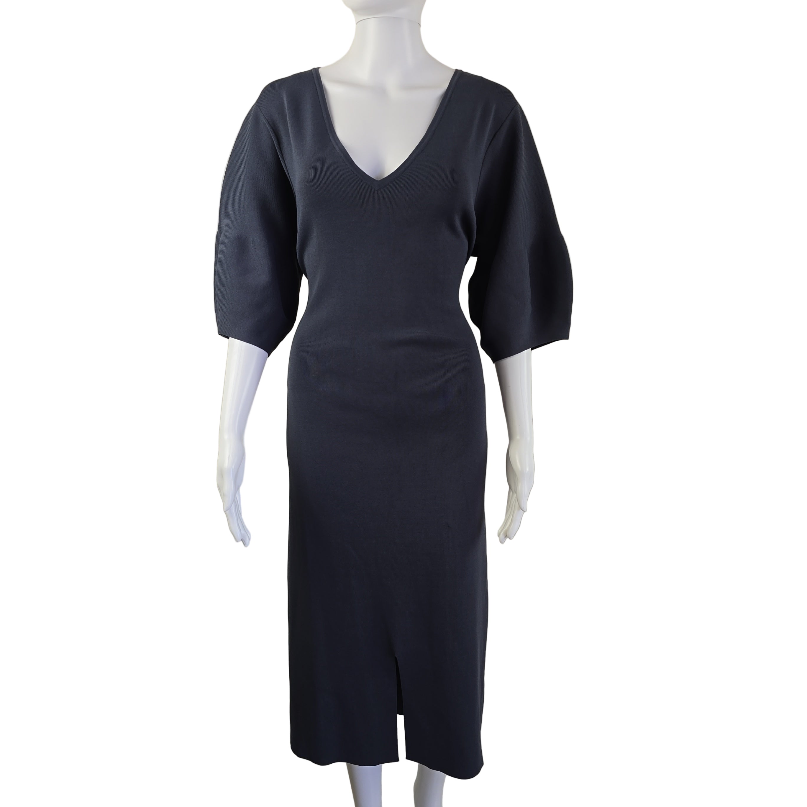 Grey dress on a mannequin against a plain background