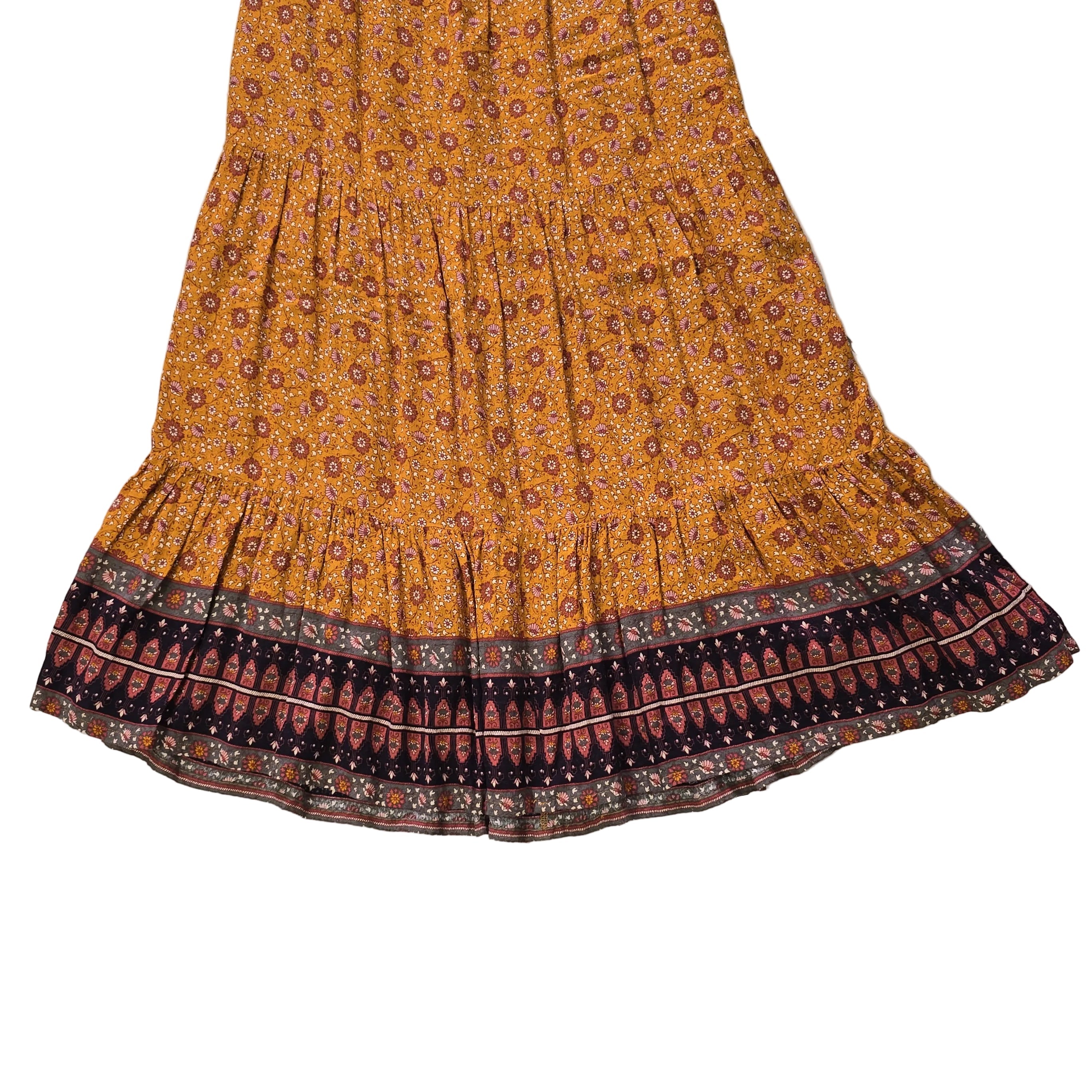 Orange and brown patterned fabric on a light background