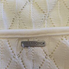 Close-up of a Billabong logo on a textured white surface