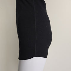 Black sleeveless top on a light background