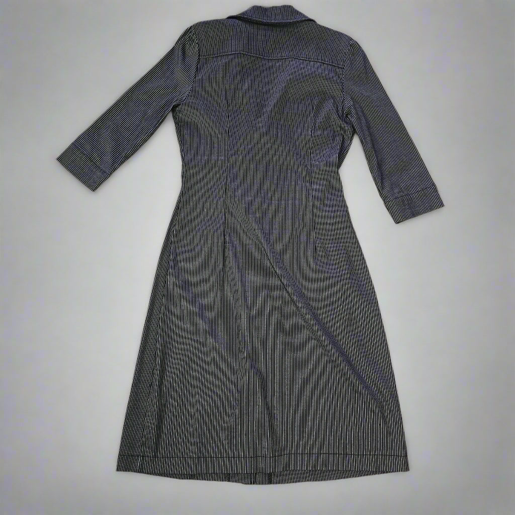 Dark gray dress on a tiled floor