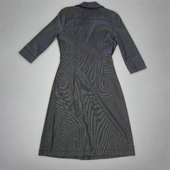 Dark gray dress on a tiled floor