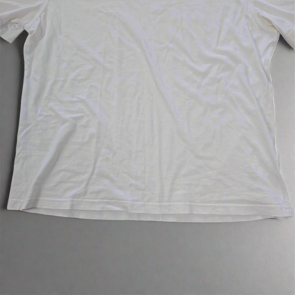 White t-shirt on a tiled floor