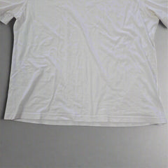 White t-shirt on a tiled floor