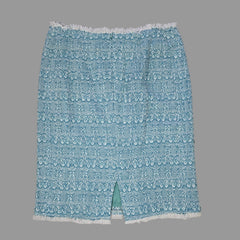 Blue textured fabric skirt on a tiled floor