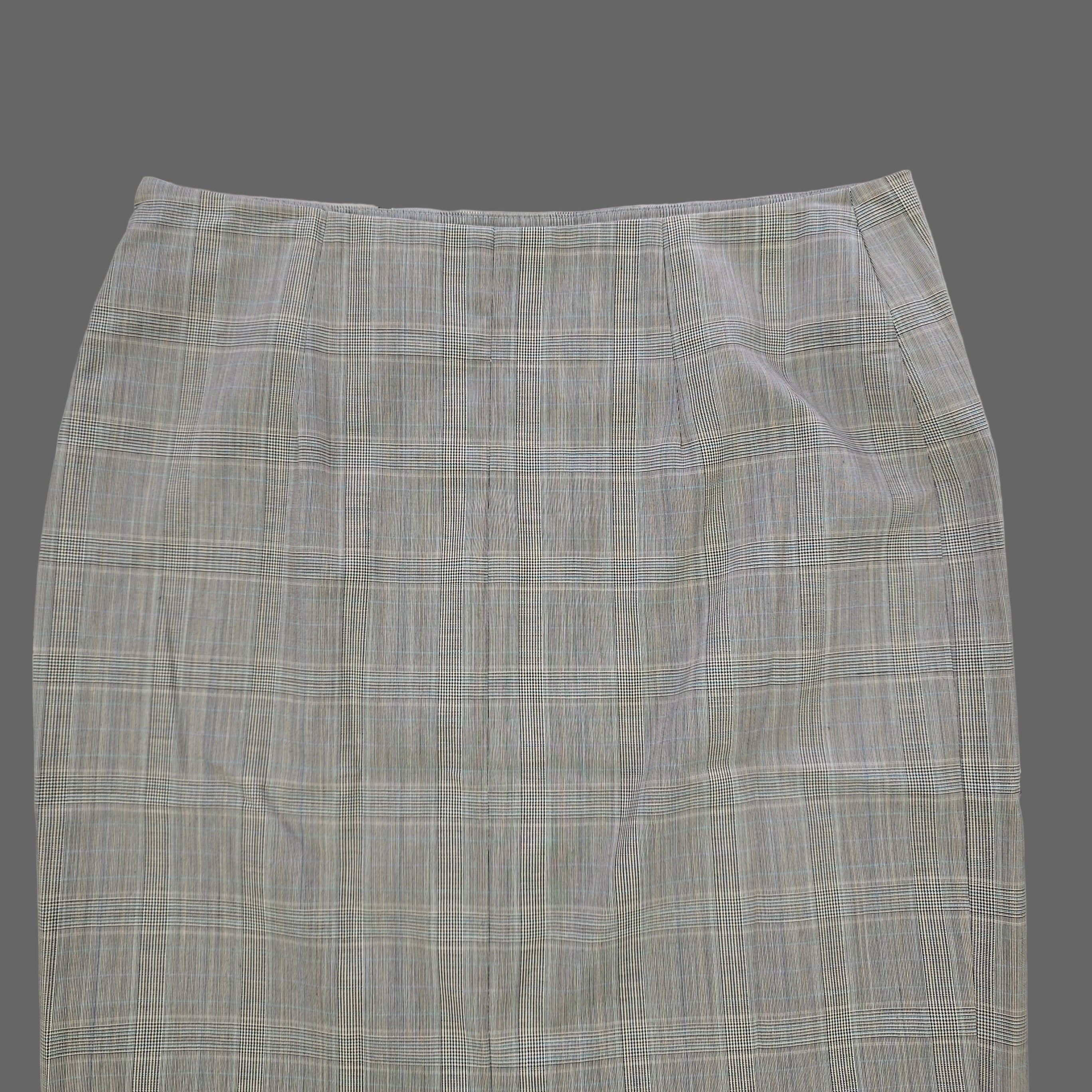 Gray checkered skirt on a tiled floor