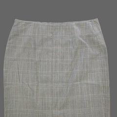 Gray checkered skirt on a tiled floor