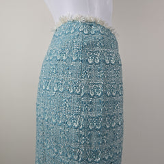 Textured blue fabric skirt on a white background