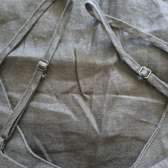 Close-up of a gray fabric with straps and buckles