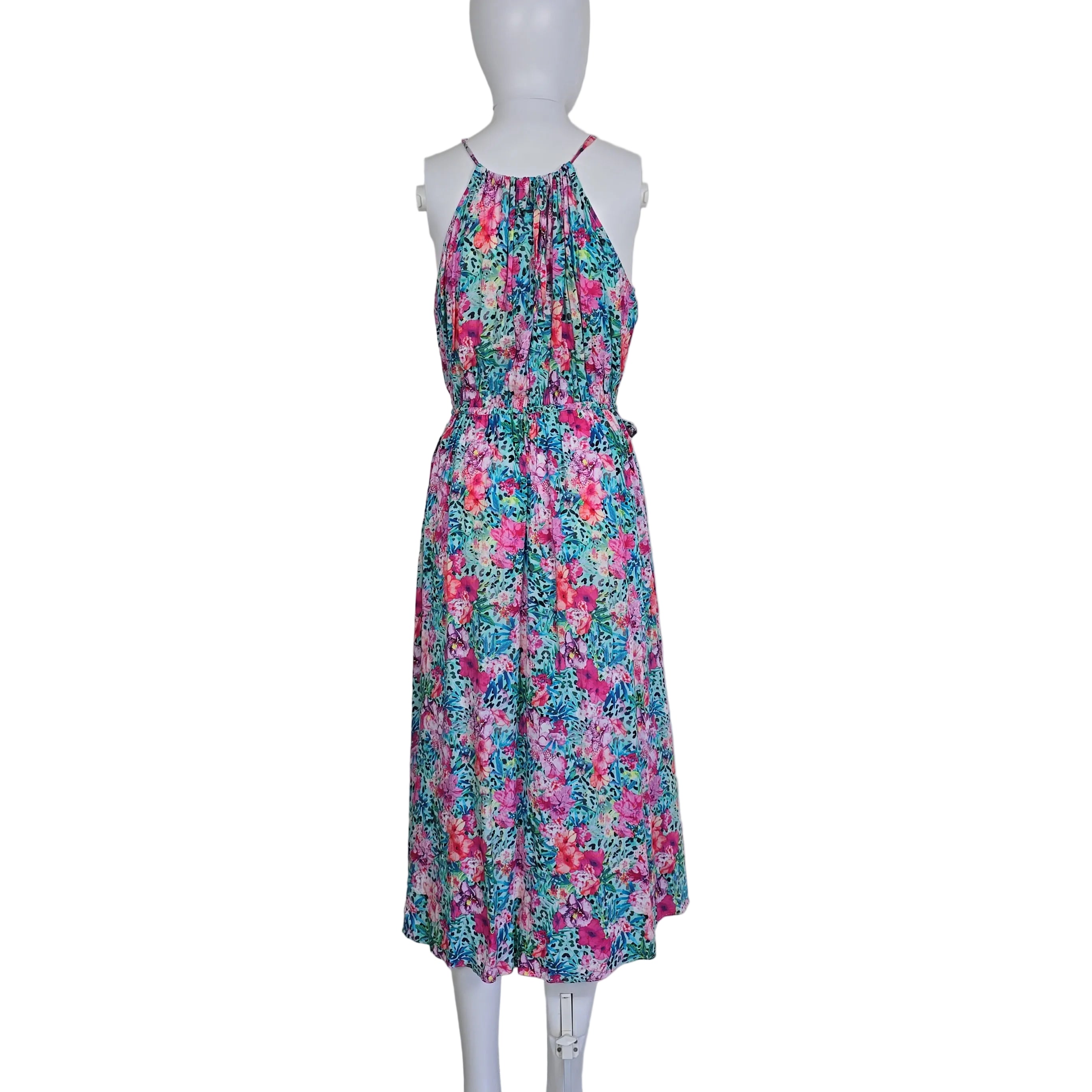 Floral dress on a mannequin against a white background
