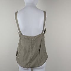 Grey top on a mannequin against a plain background