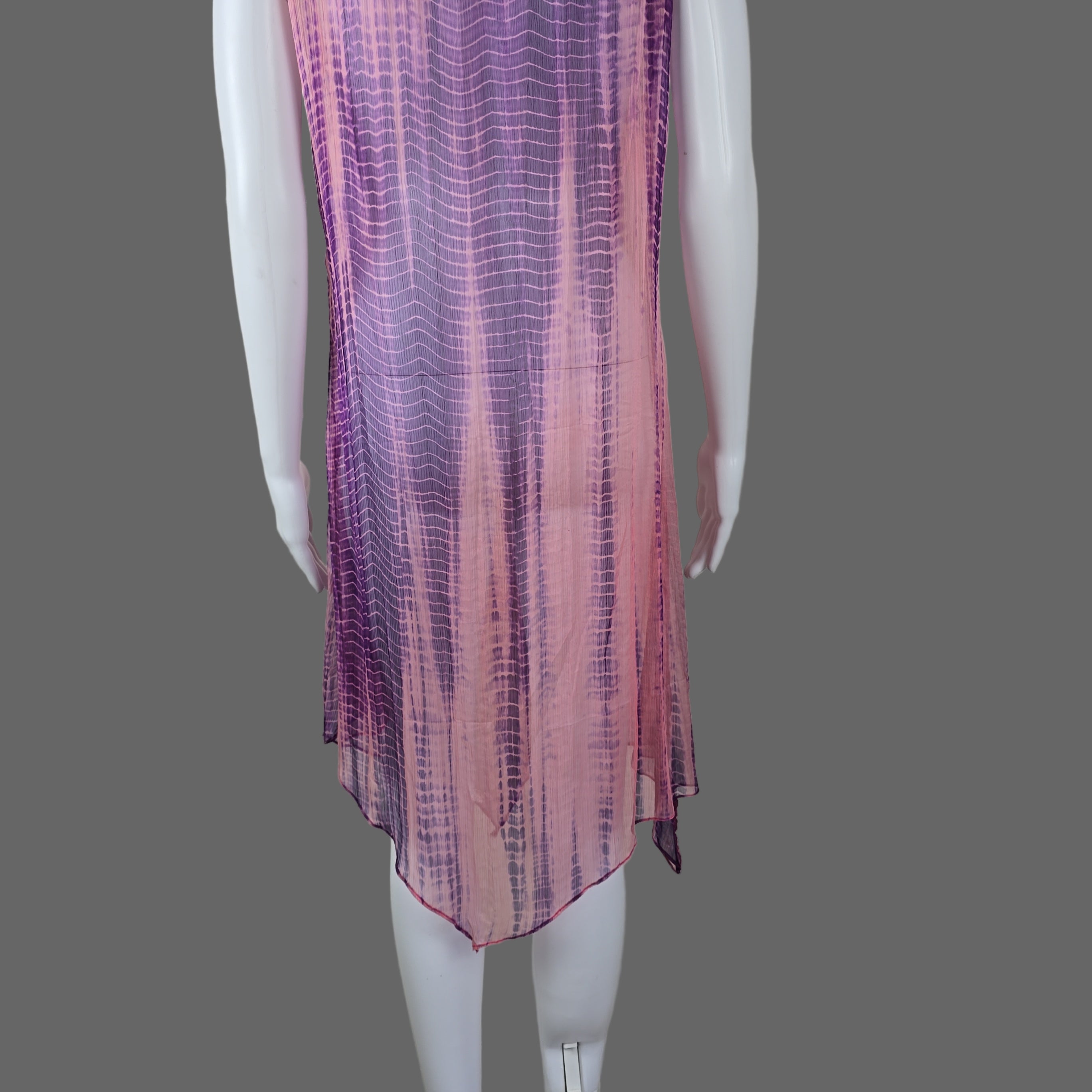 Purple and pink patterned fabric on a white surface