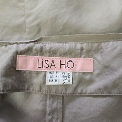 Label on a garment with 'Lisa Ho' branding and size information.