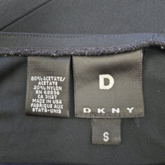 Close-up of DKNY label on a garment with fabric texture visible