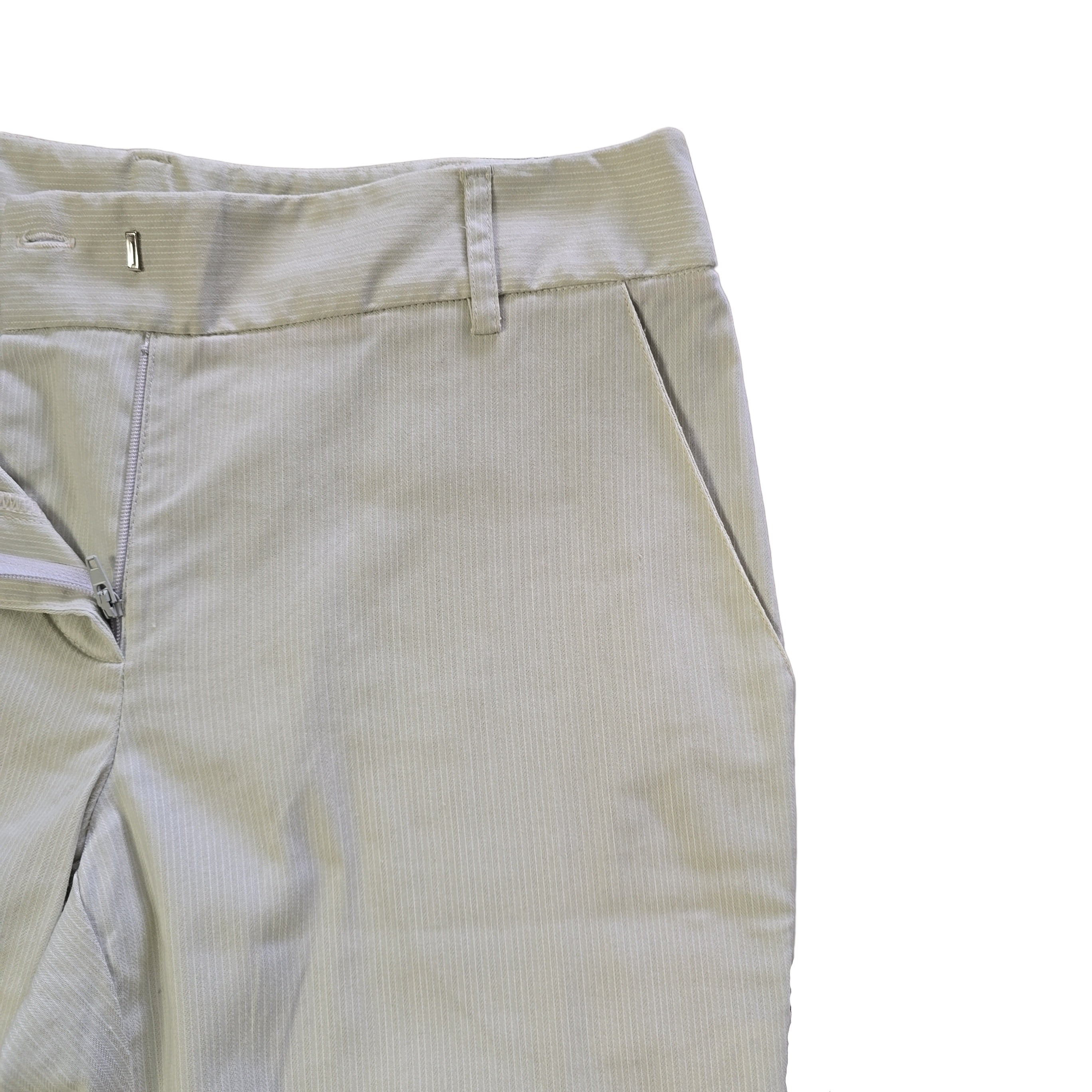 Light-colored pants on a tiled floor