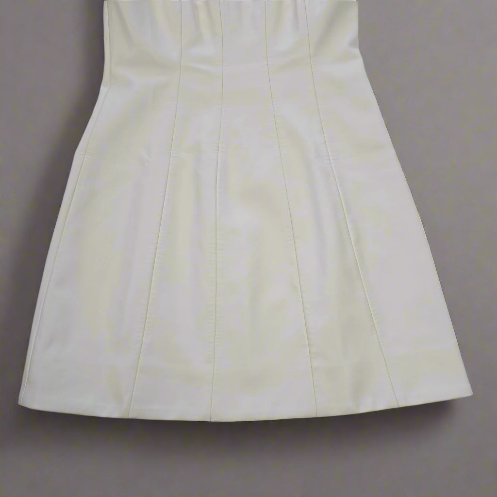White strapless dress on a tiled floor