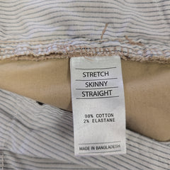 Fabric with a label indicating 'Stretch Skinny Straight' and material composition.