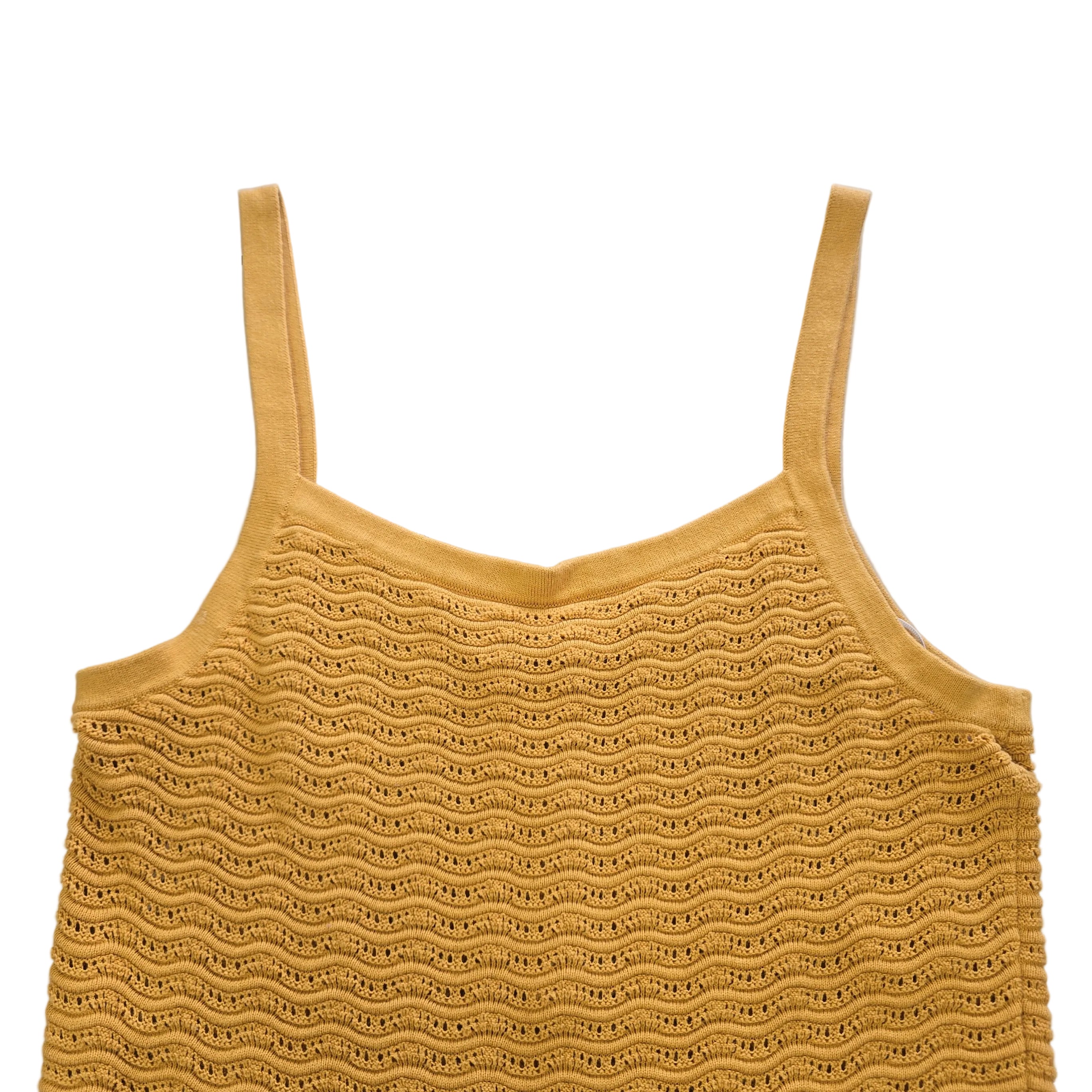 Yellow knitted tank top on a light background