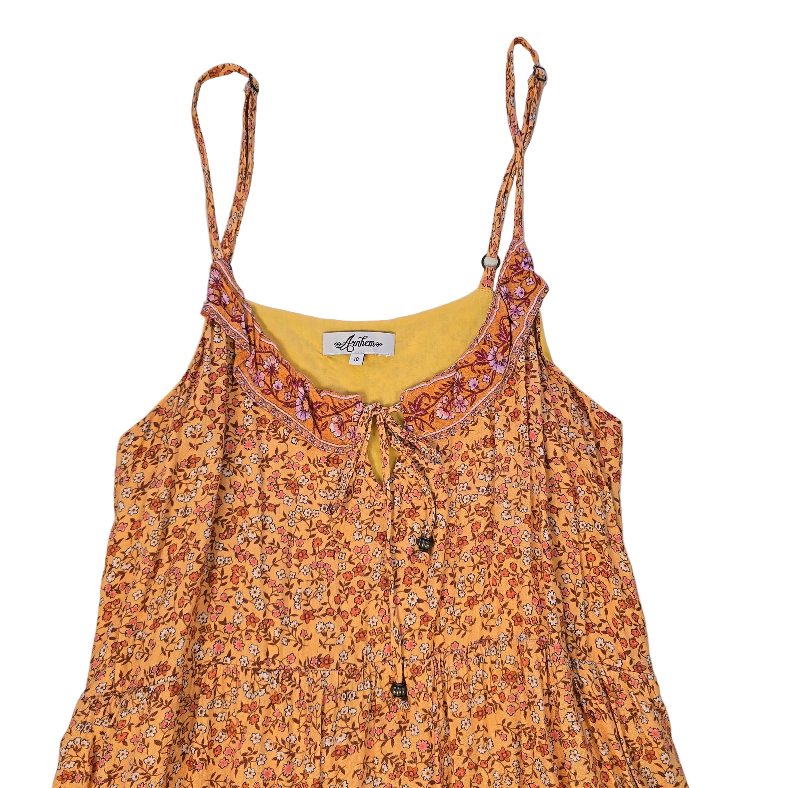 Floral dress with a visible brand tag on a light background