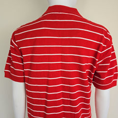 Red and white striped fabric draped over a mannequin on a beige background