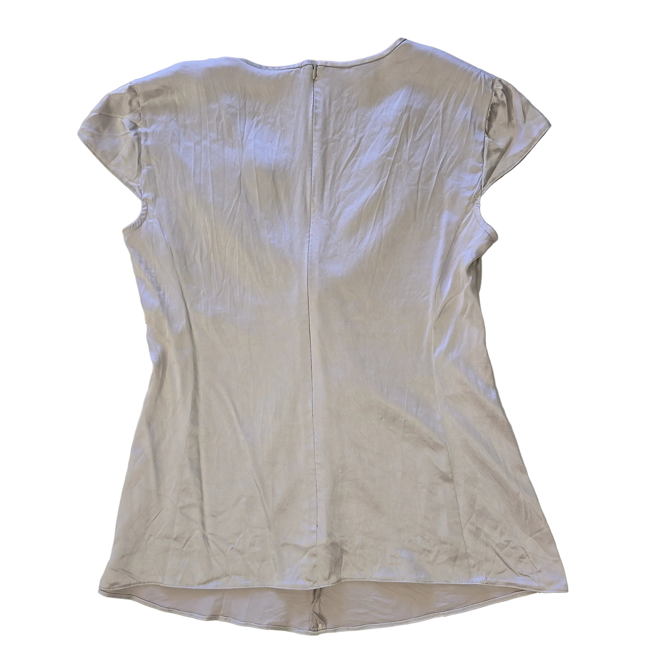 Silver metallic top on a plain background