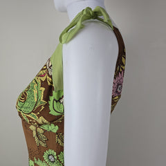 Floral-patterned fabric with a green tie on a white background